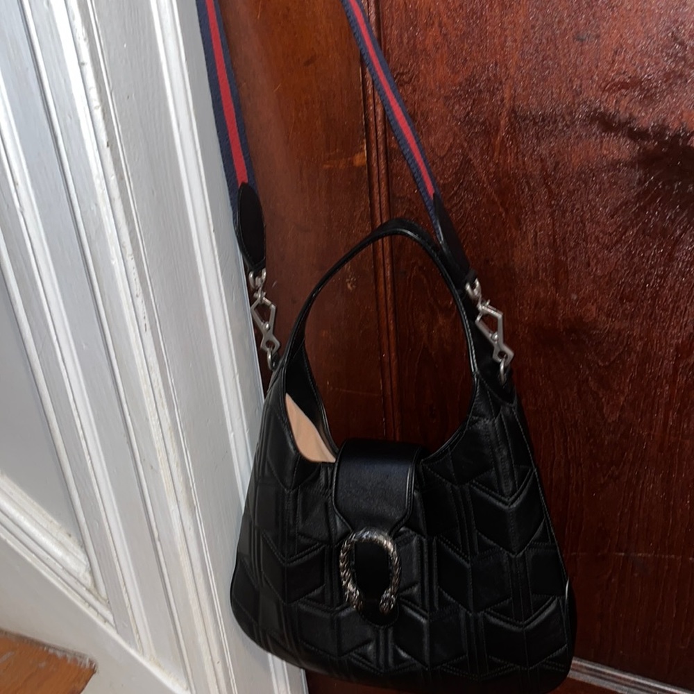 1 of a kind Gucci bag.  wear /without the strap. Excellent condition